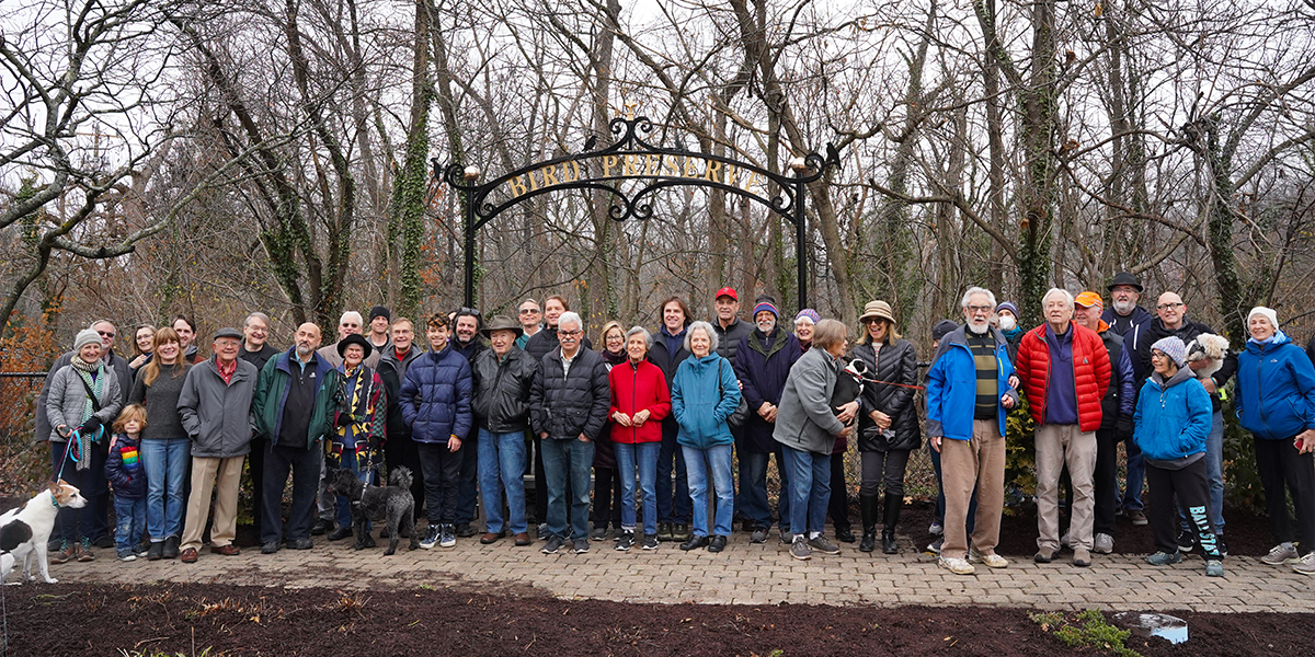 Group photo in front of new Rawson Archway sign